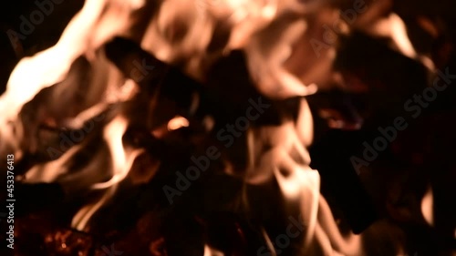 Firewood burning in a campfire in the evening