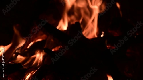 Firewood burning in a campfire in the evening