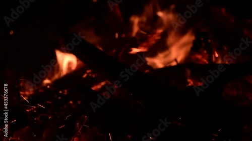 Firewood burning in a campfire in the evening