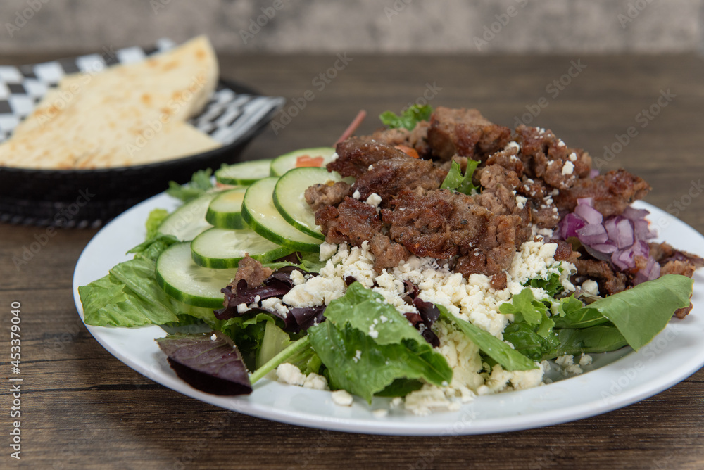 Health conscious eaters can have the greek salad loaded withf fresh vegetables and served with pita quarters Health conscious eaters can have the greek salad loaded withf fresh vegetables and served with pita quarters