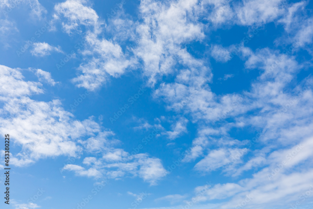 Small clouds in a blue sky on the Oregon coast.