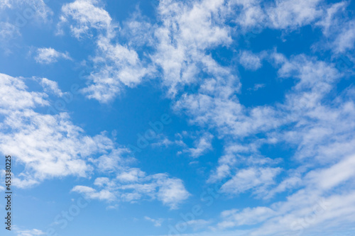 Fototapeta Naklejka Na Ścianę i Meble -  Small clouds in a blue sky on the Oregon coast.