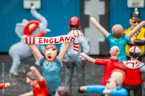 Closeup of England figurines celebrating football match