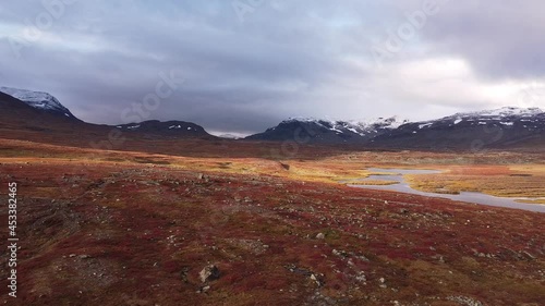 Sunrise at Kungsleden trail near Alesjaure cottage in September, autumn in Lapland between Abisko and Nikkaluokta, September photo