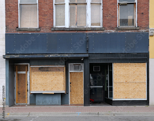 Closed business with boarded up windows