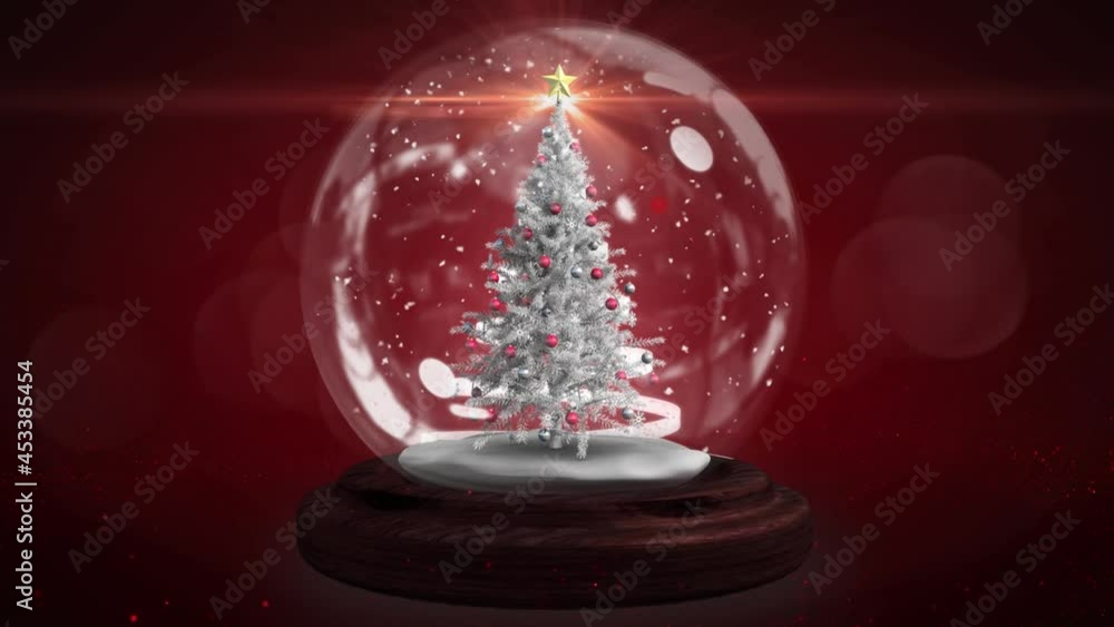 Animation of christmas tree in snow globe and shooting star Animation of christmas tree in snow globe and shooting star
