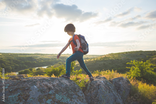 boy with a backpack on a hike