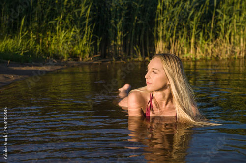 Fototapeta Naklejka Na Ścianę i Meble -  wet young woman in swimsuit