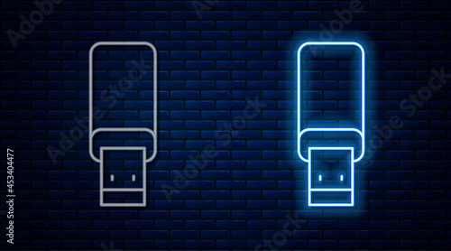 Glowing neon line USB flash drive icon isolated on brick wall background. Vector