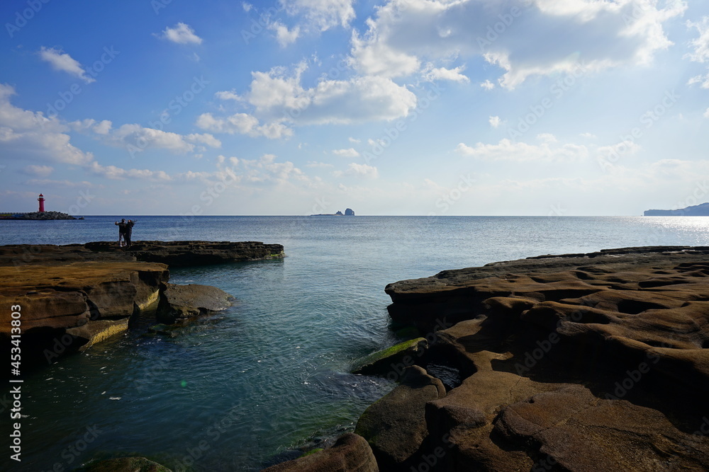 a beautiful seaside landscape with charming clouds