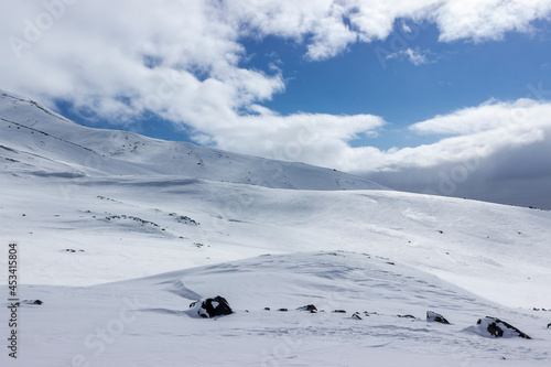 a mountain pass covered with snow, the photo express a feeling of cold and loneliness. single tourism safety concept.