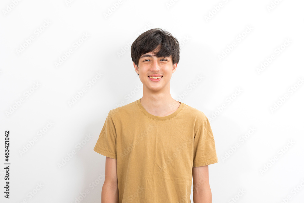 Handsome young man wearing casual t shirt looking confident at the camera with smile on white background. Handsome young man wearing casual t shirt looking confident at the camera with smile on white background.