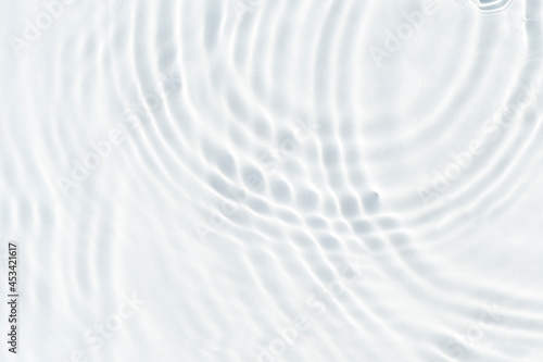 White wave abstract in sunlight or rippled water texture background. Top view, flat lay © Alex