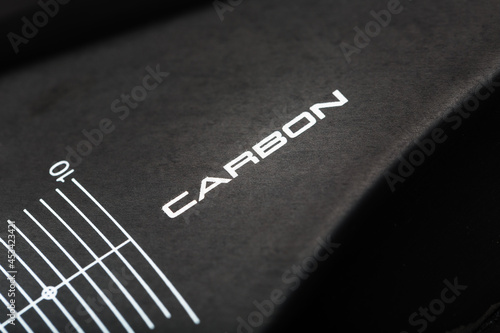 Composite product made of carbon fiber with the inscription CARBON and a distance scale