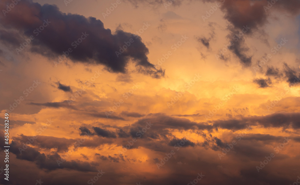 The sky during sunset. Orange sky and clouds.