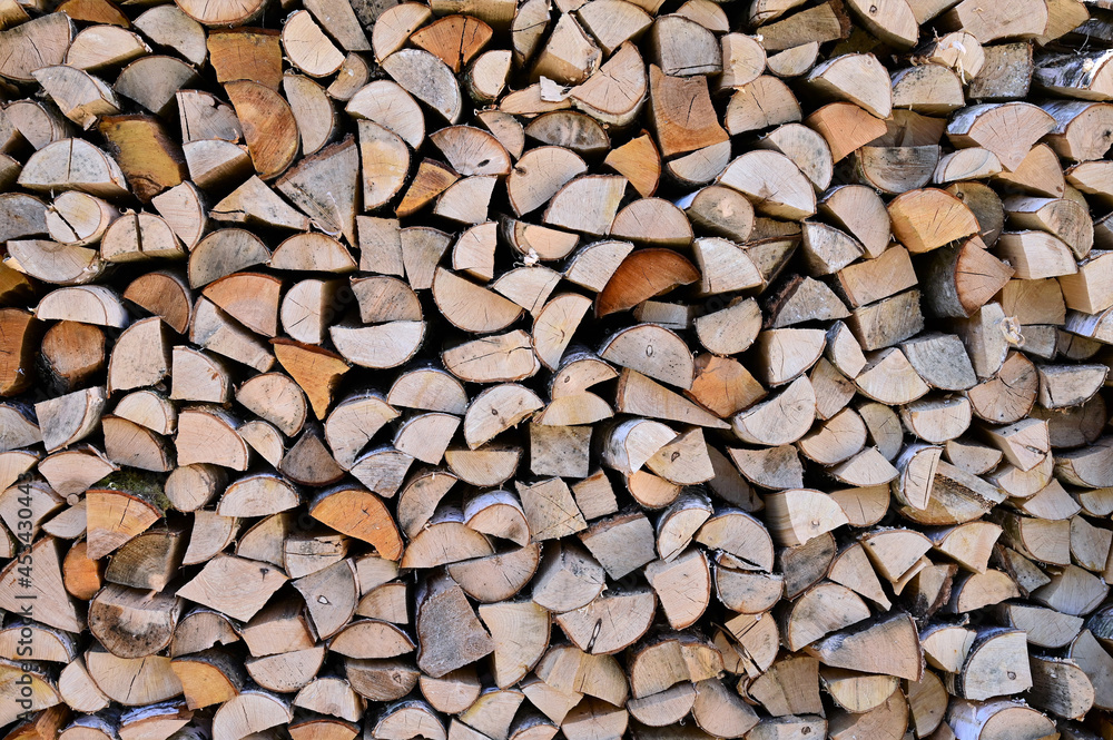 Preparation of firewood for winter. A woodpile made of birch wood. Copy space. Firewood background Preparation of firewood for winter. A woodpile made of birch wood. Copy space. Firewood background