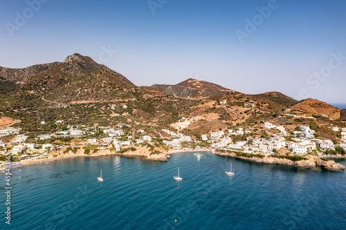 panoramic view of the sea and mountains and ships on turquoise water filmed from a drone