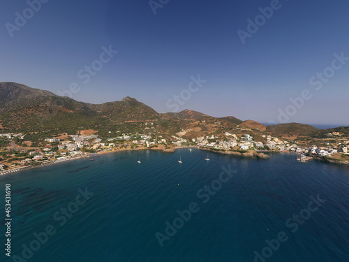 Fototapeta Naklejka Na Ścianę i Meble -  panoramic view of the sea and mountains and ships on turquoise water filmed from a drone