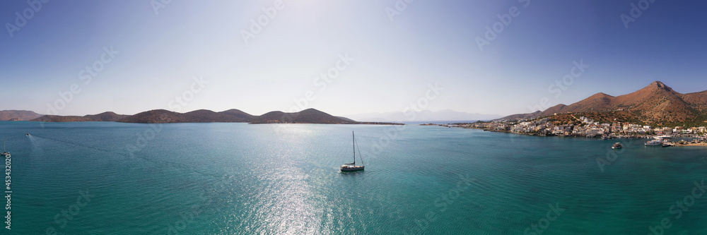 panoramic view of the sea and mountains and ships on turquoise water filmed from a drone panoramic view of the sea and mountains and ships on turquoise water filmed from a drone