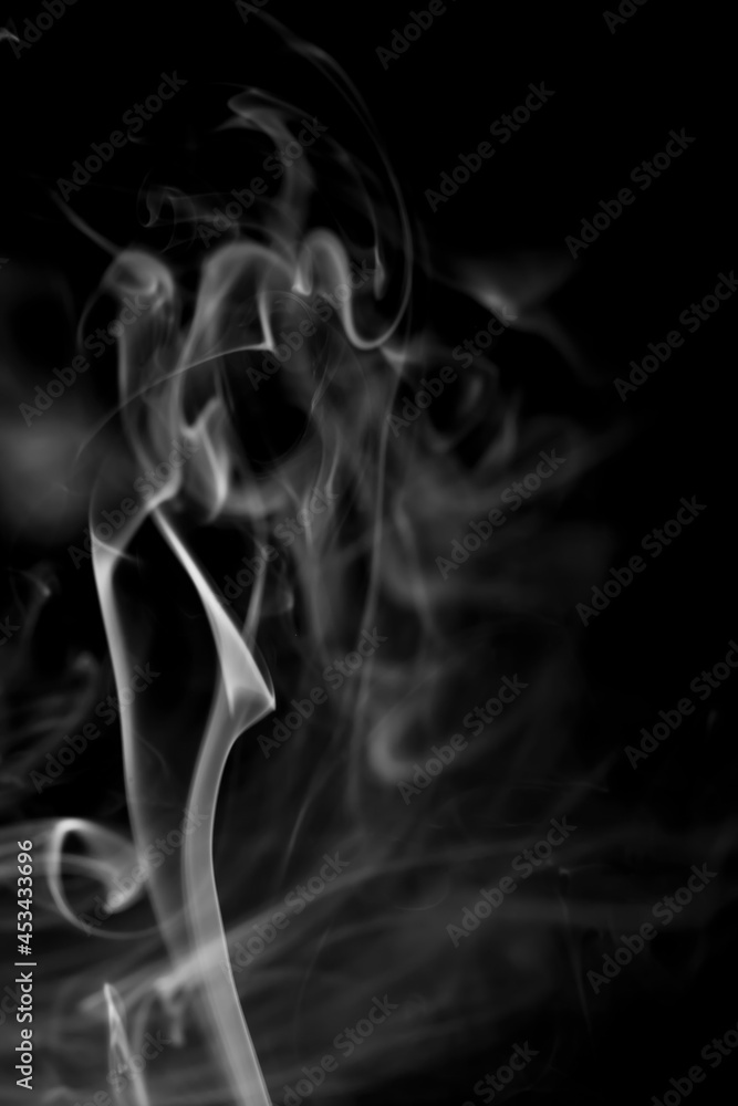Obraz premium White smoke on black background.