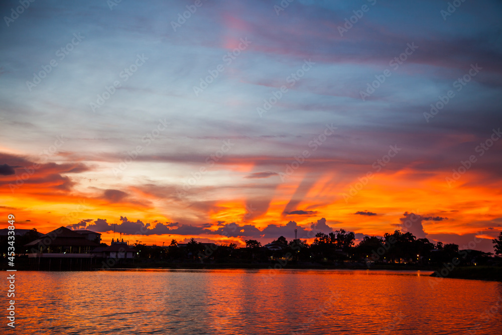 Fototapeta premium Red sunset vivid over the lake.