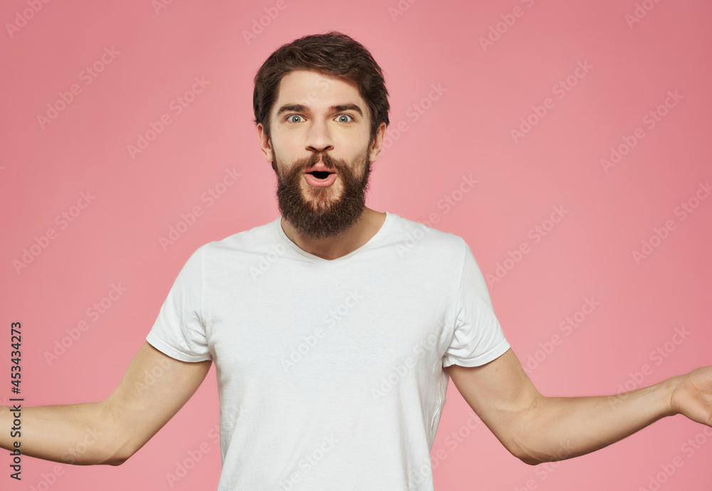 bearded man in a white t-shirt expressive look discontent close-up bearded man in a white t-shirt expressive look discontent close-up
