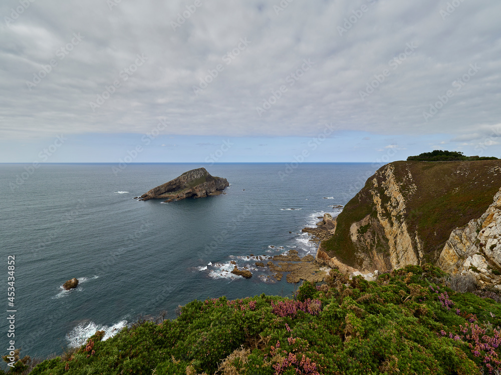 Deva Island, in Asturias, Spain, seen from the coastal cliffs.