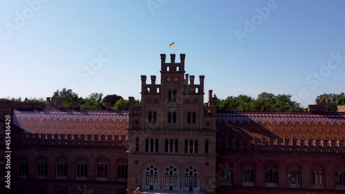 Chernivtsi State University. The main building of Chernivtsi State University. Architecture of Chernivtsi University. Ukrainian flag airo shooting. photo