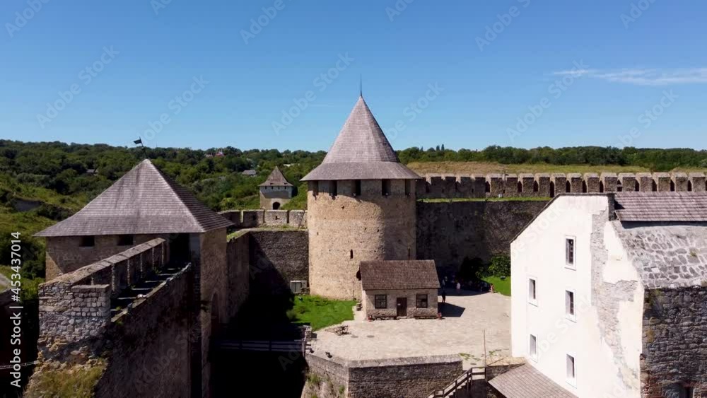 Khotyn fortress from a bird's eye view. Flight over the Fortress in Khotyn, Ukraine. Historical monuments of Ukraine. Historic castle. Fortress on the banks of the Dniester. History of Ukraine. Khotyn fortress from a bird's eye view. Flight over the Fortress in Khotyn, Ukraine. Historical monuments of Ukraine. Historic castle. Fortress on the banks of the Dniester. History of Ukraine.