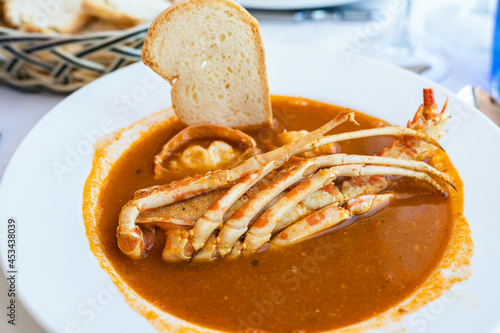 Lobster stew, a typical Menorcan dish.
Gastronomy, tourism, lobster stew with bread photo