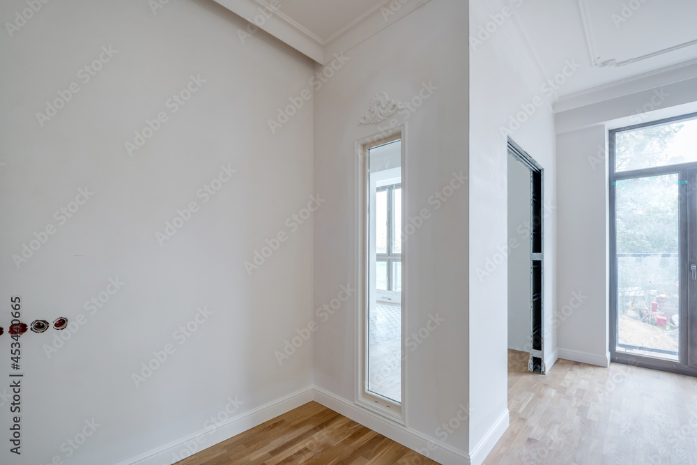 empty white room with repair and without furniture with panoramic windows empty white room with repair and without furniture with panoramic windows