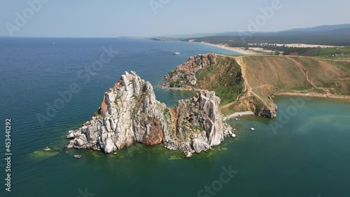 Olkhon Island, the largest island in Lake Baikal in eastern Siberia. Shamanka Rock on Baikal lake near Khuzhir at Olkhon island in Siberia, Russia.