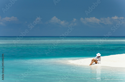 Girl on the shore of the Maldives