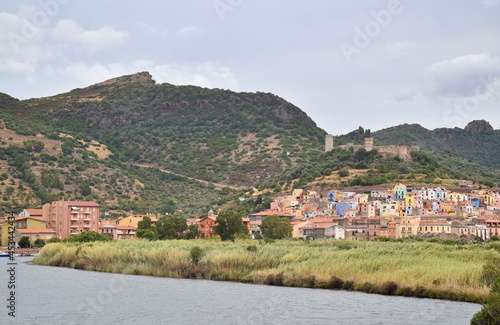 Distant view towards the colorful houses of Bosa, Sardinia, Italy © Ingmar
