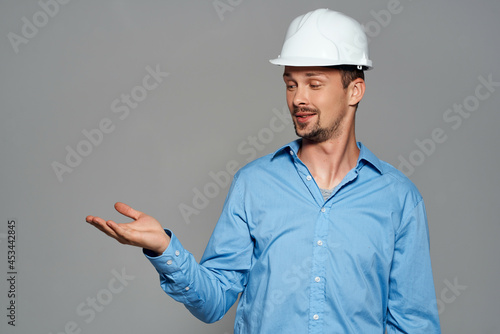 man in working uniform white construction helmet safety professional