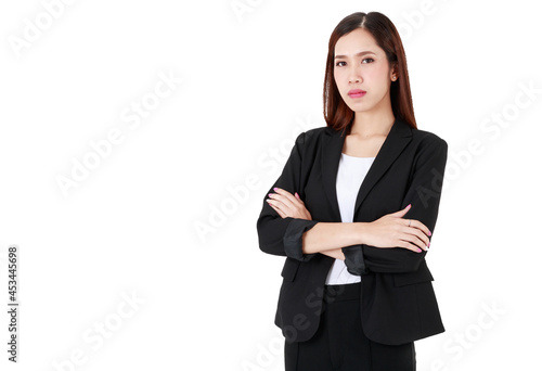 Portrait of an asian beautiful business working woman with long hair wearing formal black suit, smiling with confidence, crossing her arms with isolated white background cutout and blank copy space.