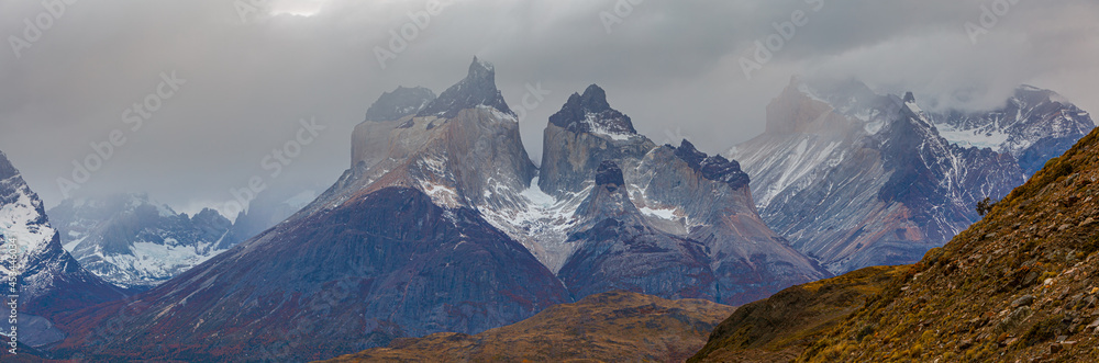 panoramic image of the jagged mountain peaks of Los Cuernos in the Paine Mountain range, Chile