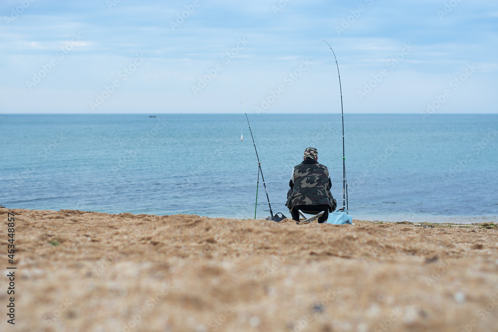 A fisherman at the sea