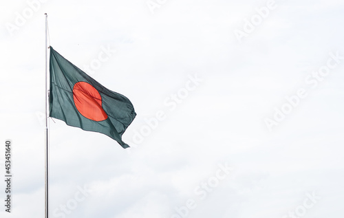 Bangladesh national flag waving under the clean sky with copy space