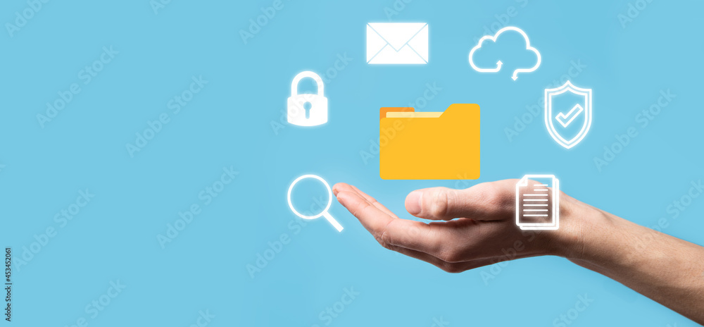 Document Management System DMS .Businessman hold folder and document icon.Software for archiving, searching and managing corporate files and information.Internet Technology Concept.Digital security