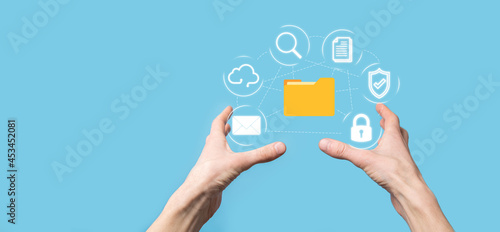 Document Management System DMS .Businessman hold folder and document icon.Software for archiving, searching and managing corporate files and information.Internet Technology Concept.Digital security