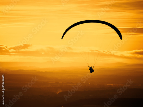 Paragliding on the beautiful sunset