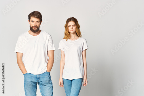 man and woman in white t-shirts fashion design mockup studio