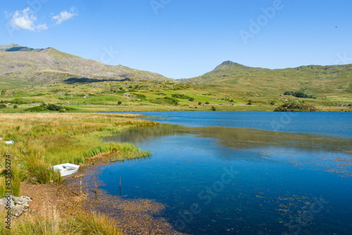 Snowdonia, Wales, Llyn y Gader. Beautiful lake by Beddgelert forest. Tranquil mountain scene on a sunny summers day. Landscape aspect shot. Copy space.