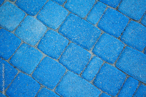 Abstract background of a modern paved sidewalk top view.