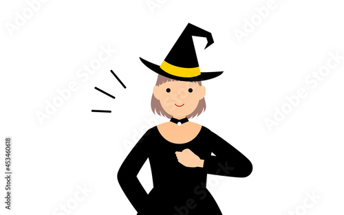 ハロウィンの仮装、魔女姿の女の子が胸を叩いているお任せあれのポーズ