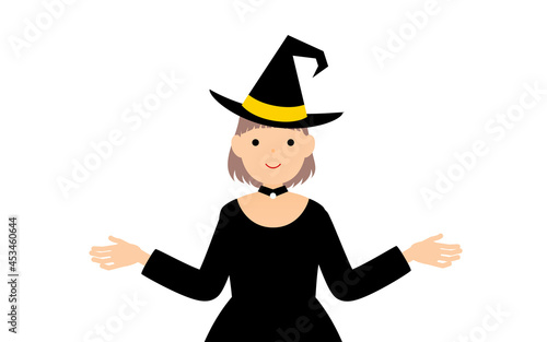 ハロウィンの仮装、魔女姿の女の子が両腕を広げるポーズ
