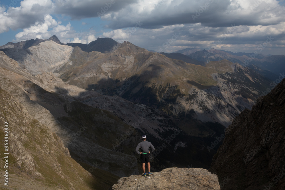 Mountaineer enjoying the views of mountains of Ordesa.