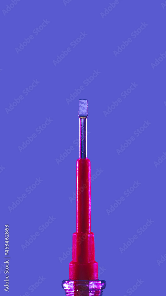 Tool concept with screwdriver in duotone blue red and silver Tool concept with screwdriver in duotone blue red and silver