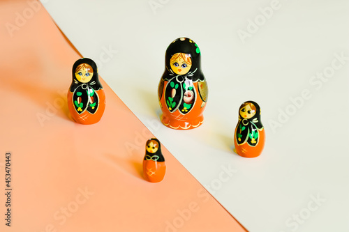 A set of 4 russion dolls in a diamond shape.  photo